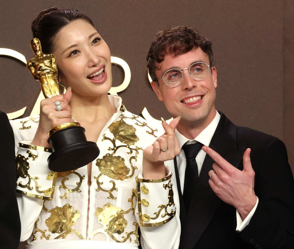 Ejae and Mark Sonnenblick, winners of the best original song award for “Golden” from KPop Demon Hunters, pose during the 98th Oscars. Photo: Getty Images via AFP