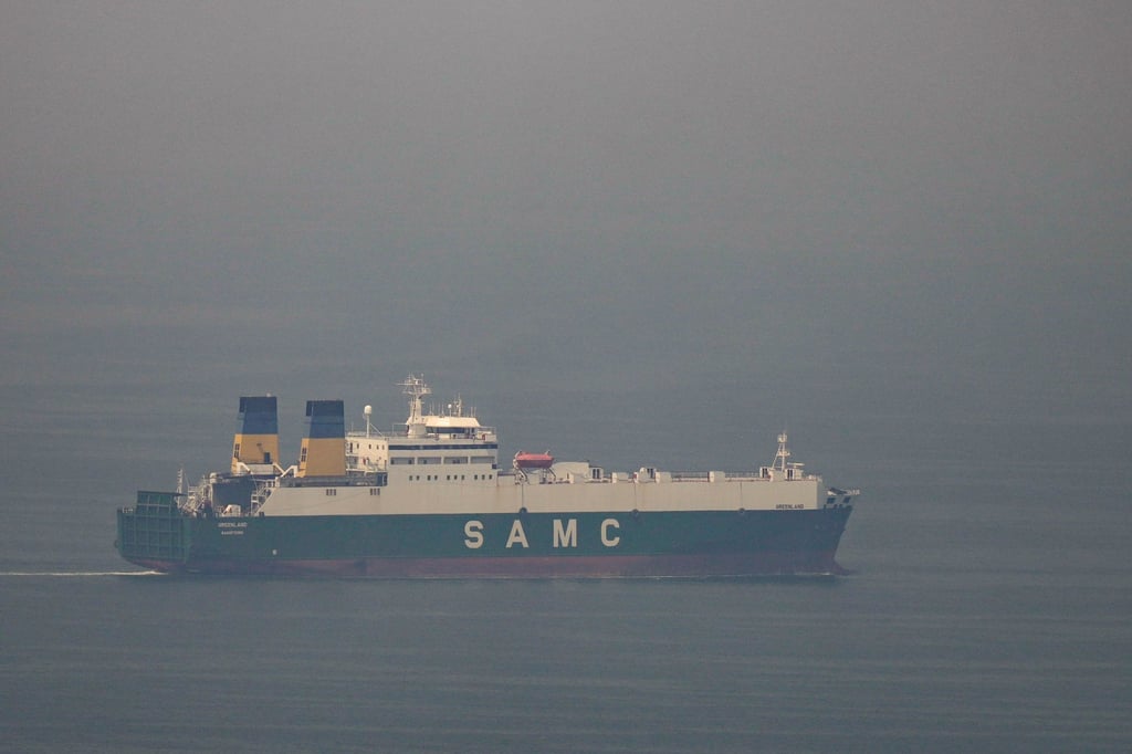 A cargo ship sails in the Persian Gulf towards the Strait of Hormuz in the United Arab Emirates on Sunday. Photo: AP