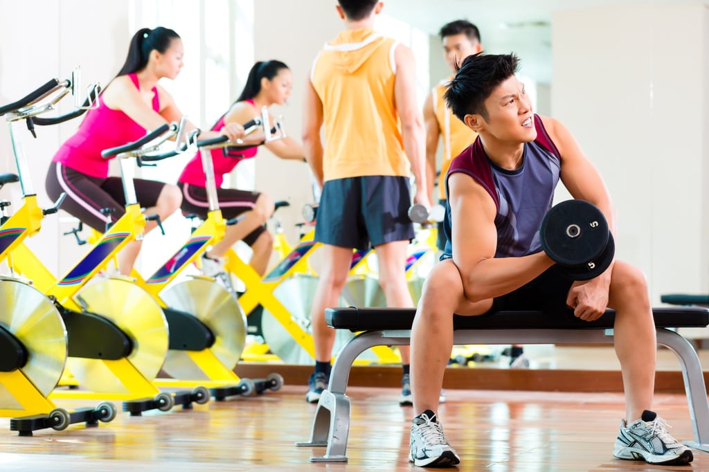 Young Chinese people exercise at a gym in a bid to shed weight and build muscle. Photo: Shutterstock Young Chinese people exercise at a gym in a bid to shed weight and build muscle. Photo: Shutterstock