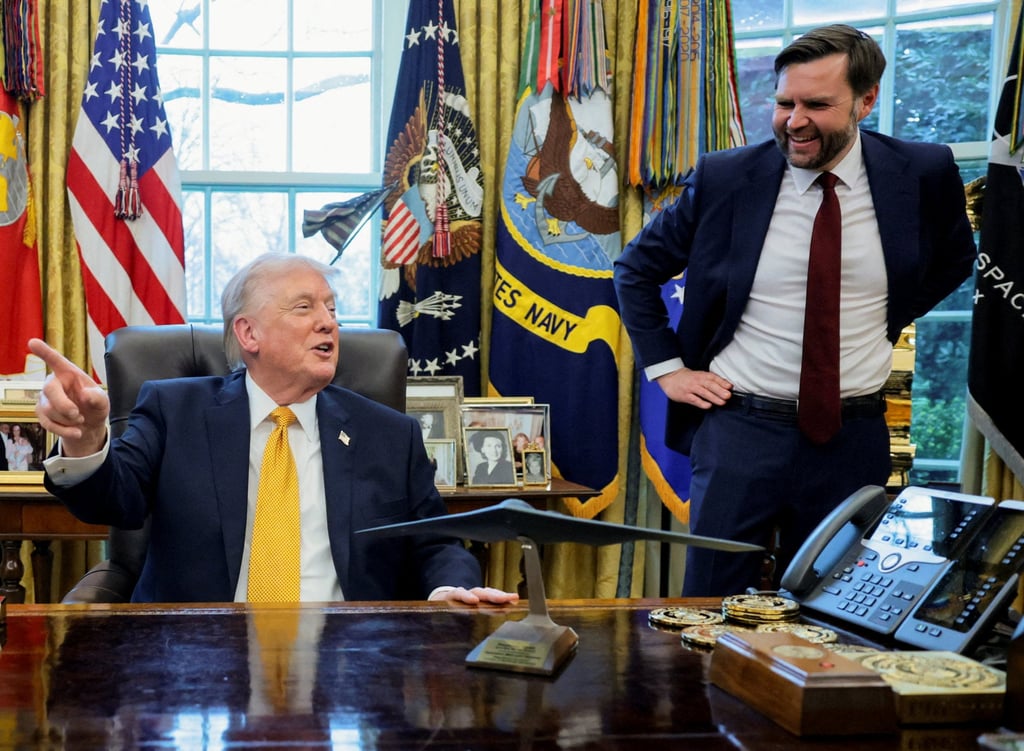 US President Donald Trump (left) jokes with Vice-President J.D. Vance in the Oval Office at the White House on Monday. Photo: Reuters
