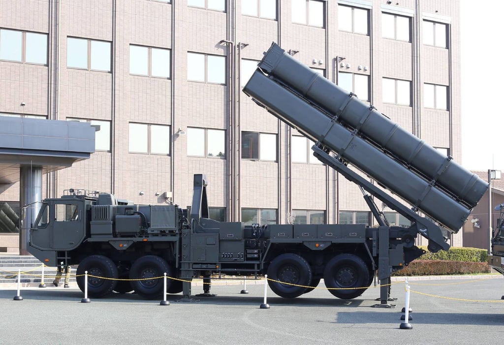 A launch vehicle for the long-range Type 12 Surface-to-Ship Guided Missile is unveiled at the Japan Ground Self-Defence Force’s Kengun Garrison in Kumamoto City on Tuesday. Photo: Jiji Press / AFP