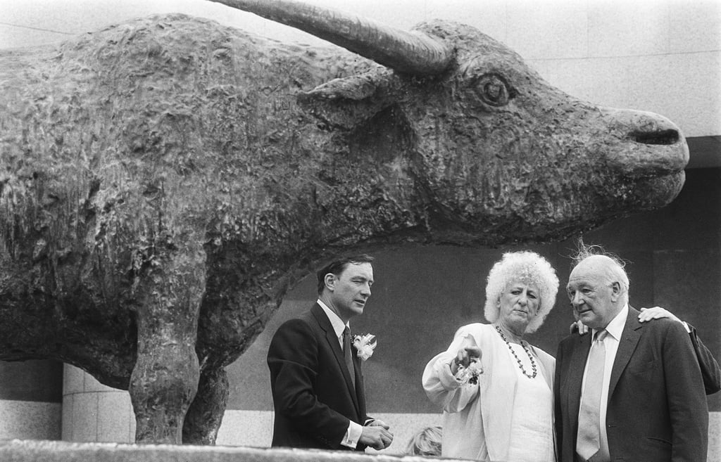 British artist Elisabeth Frink (centre) discusses her bronze water buffalo sculptures with her husband, Alex Csaky, in 1988. Looking on is Nigel Rich, managing director of Hongkong Land. The two bronze-cast water buffaloes became a permanent fixture outside the Forum at Exchange Square. Photo: SCMP Archives