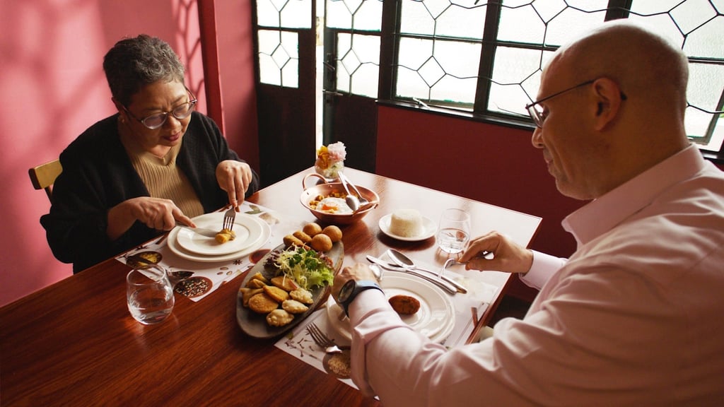 Marina de Senna Fernandes (left) and Ahmed Abdel Fattah feast on popular Macanese dishes at La Famiglia restaurant in Taipa Village, Macau.