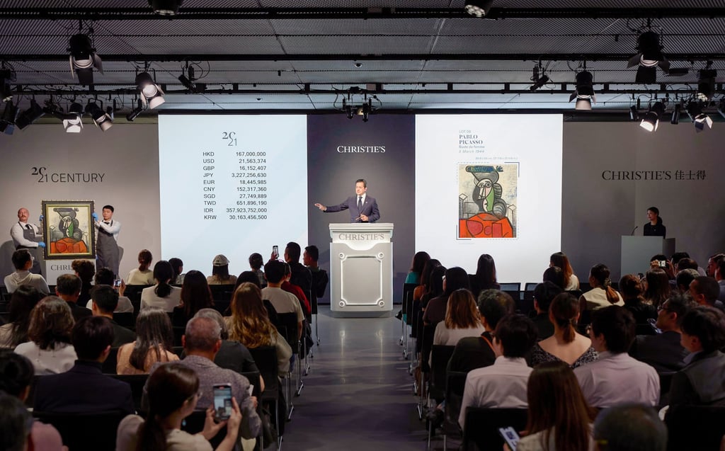 Rahul Kadakia at the rostrum during the sale of Picasso’s Buste de femme (1944) at a Christie’s auction in Hong Kong last September. Photo: courtesy Christie’s
