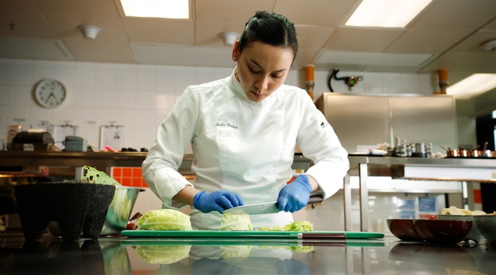 Safa Rodas, head chef of L’Attitude restaurant at Morpheus Hotel, cuts up cabbage she picked at Macau Urban Farm to serve as part of her toothfish dish.