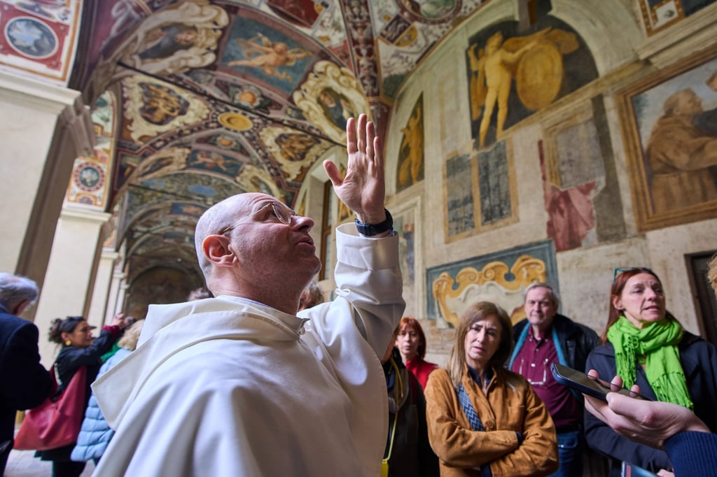Friar Aucone guides journalists through the basilica’s cloister on March 18, 2026. Photo: AP