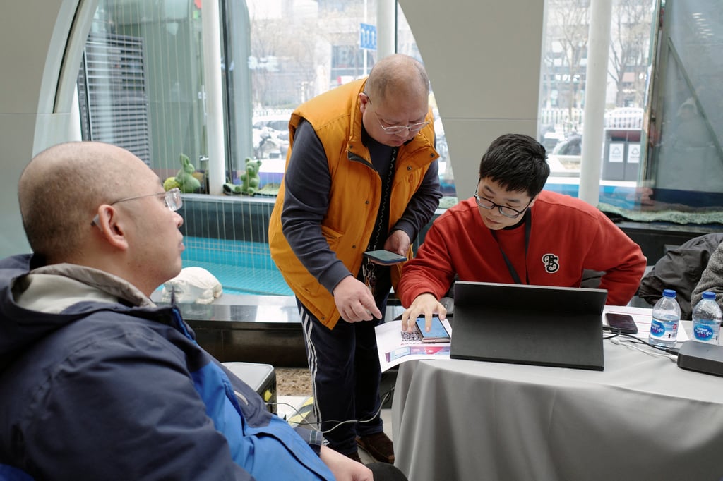 A Zhipu staff member helps residents install and setup AutoClaw, a local version of the AI agent OpenClaw developed by Zhipu, in Beijing on March 13, 2026. Photo: Reuters A Zhipu staff member helps residents install and setup AutoClaw, a local version of the AI agent OpenClaw developed by Zhipu, in Beijing on March 13, 2026. Photo: Reuters