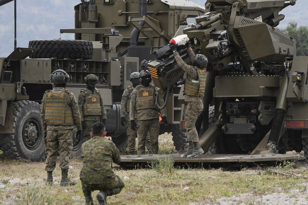 Philippine soldiers load ammunition into an Autonomous Truck Mounted Howitzer System during a live-fire exercise in Tarlac province in 2024. Photo: AFP