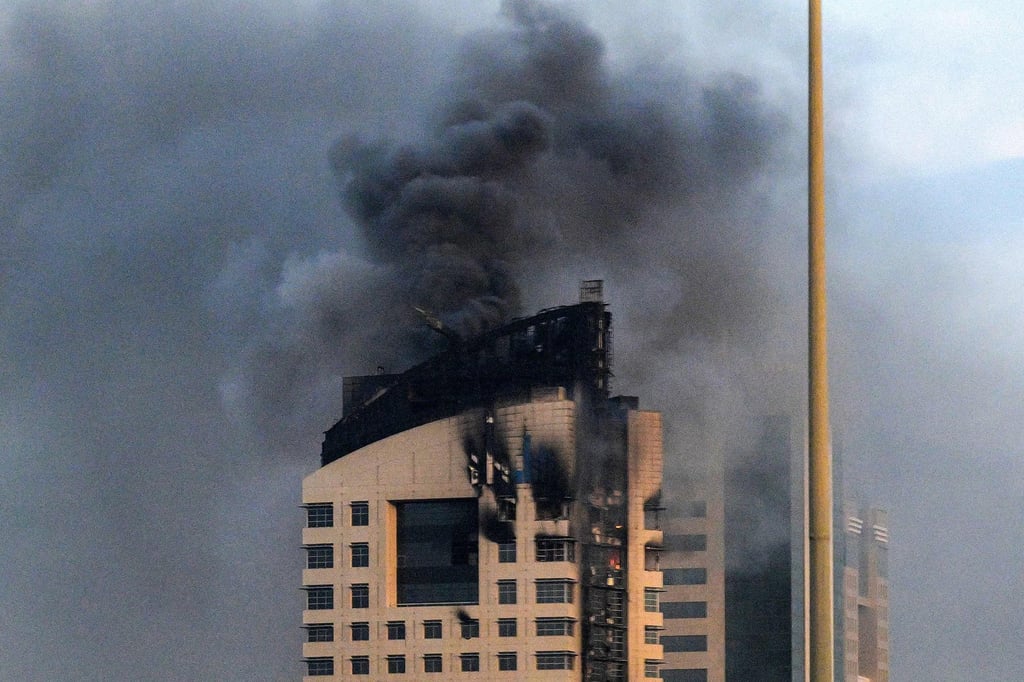 Smoke rises from a high-rise building in Kuwait City following a drone attack on March 8. Photo: AFP Smoke rises from a high-rise building in Kuwait City following a drone attack on March 8. Photo: AFP