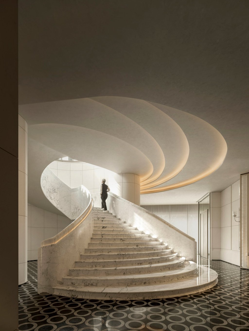 A soaring marble staircase on the ground floor. Photo: Handout