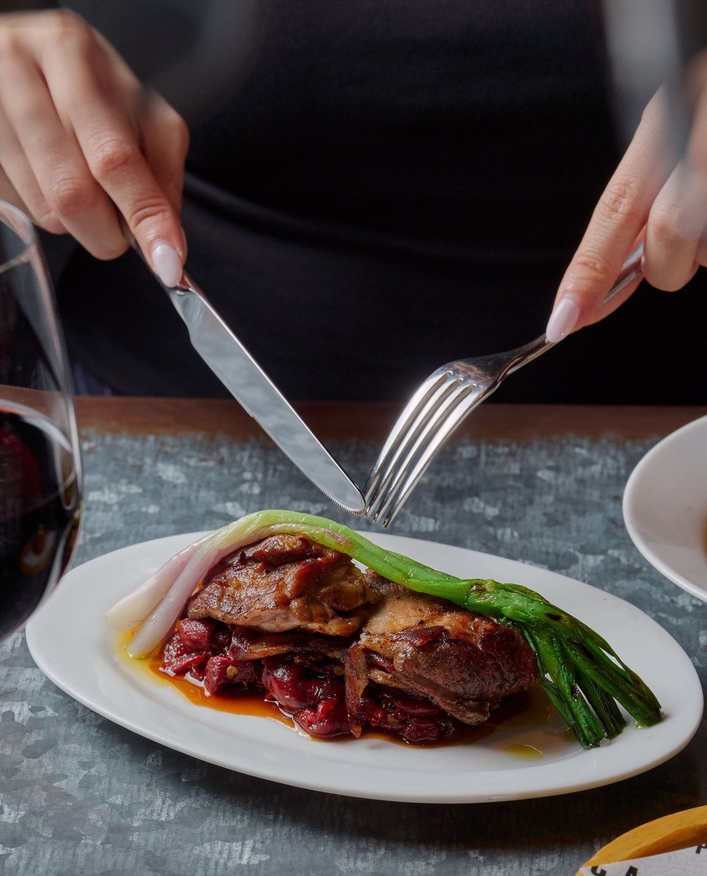 Lamb neck, caramelised piquillo peppers and charred spring onions at Pica Pica in Sheung Wan. Photo: Pica Pica
