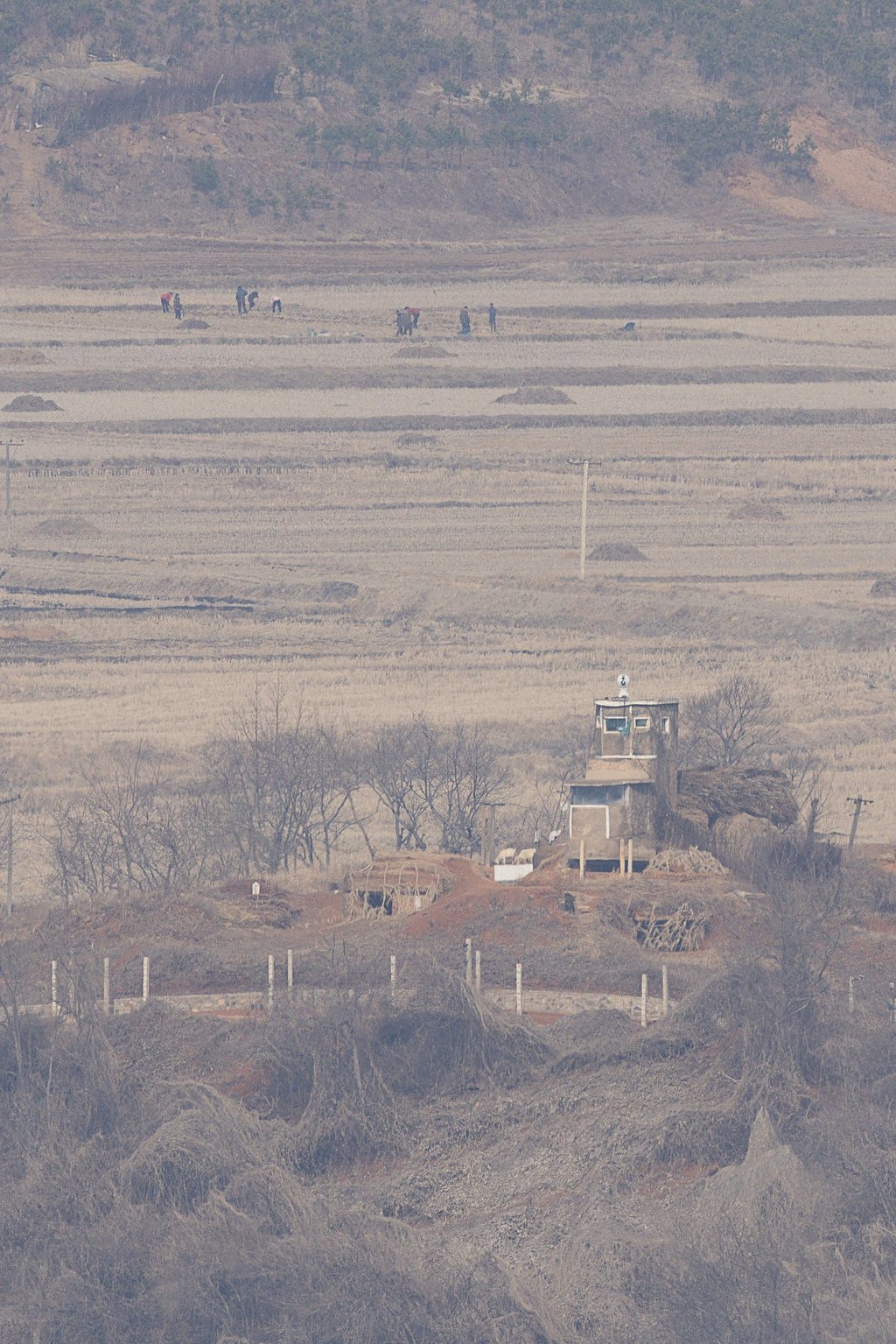 North Korean residents are seen at work in a field in Kaepung on the western frontline border with South Korea in February. The country’s forced labour scheme generates US$500 million annually for the state. Photo: EPA/Yonhap North Korean residents are seen at work in a field in Kaepung on the western frontline border with South Korea in February. The country’s forced labour scheme generates US$500 million annually for the state. Photo: EPA/Yonhap