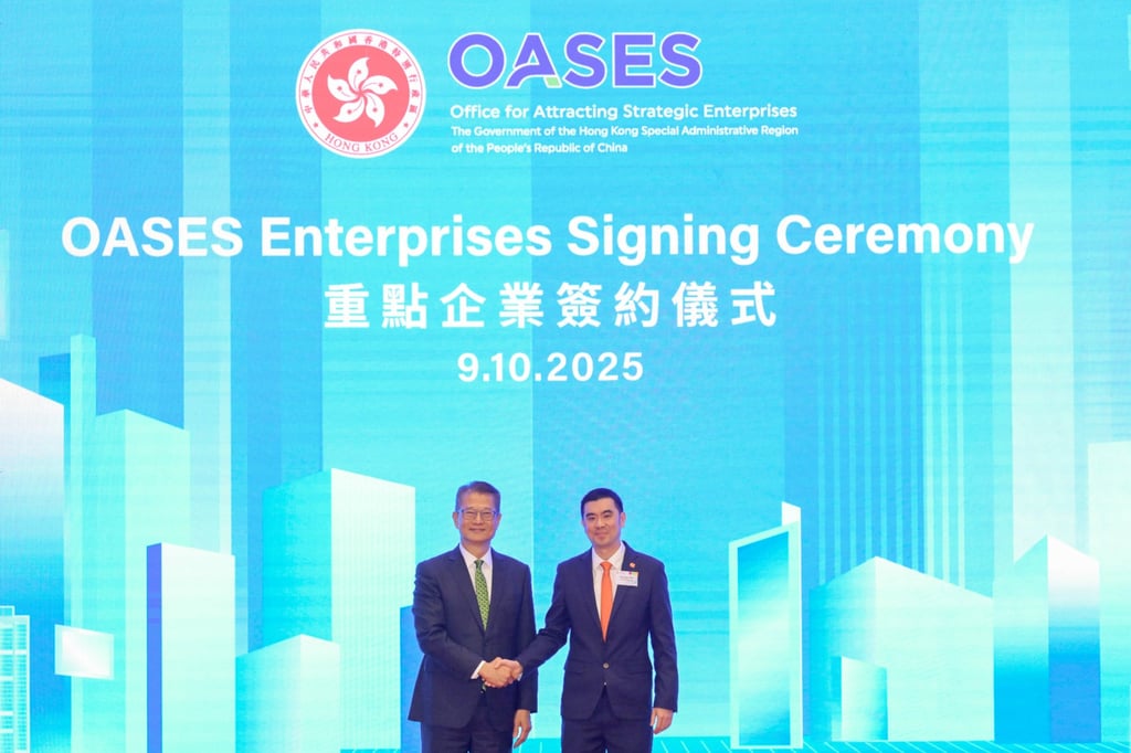 Hong Kong Financial Secretary Paul Chan Mo-po (left) with Nicholas Teo, general manager of GSK Hong Kong and Macau, at last year’s OASES enterprises signing ceremony.