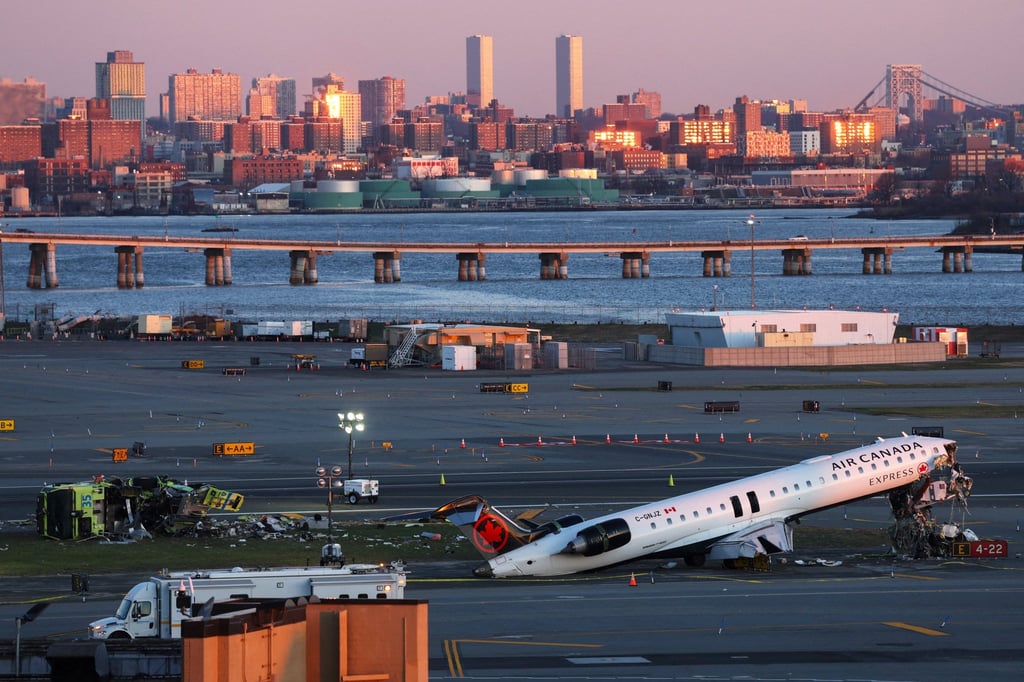 The wreckage of the Air Canada jet and Port Authority fire truck. Photo: Reuters