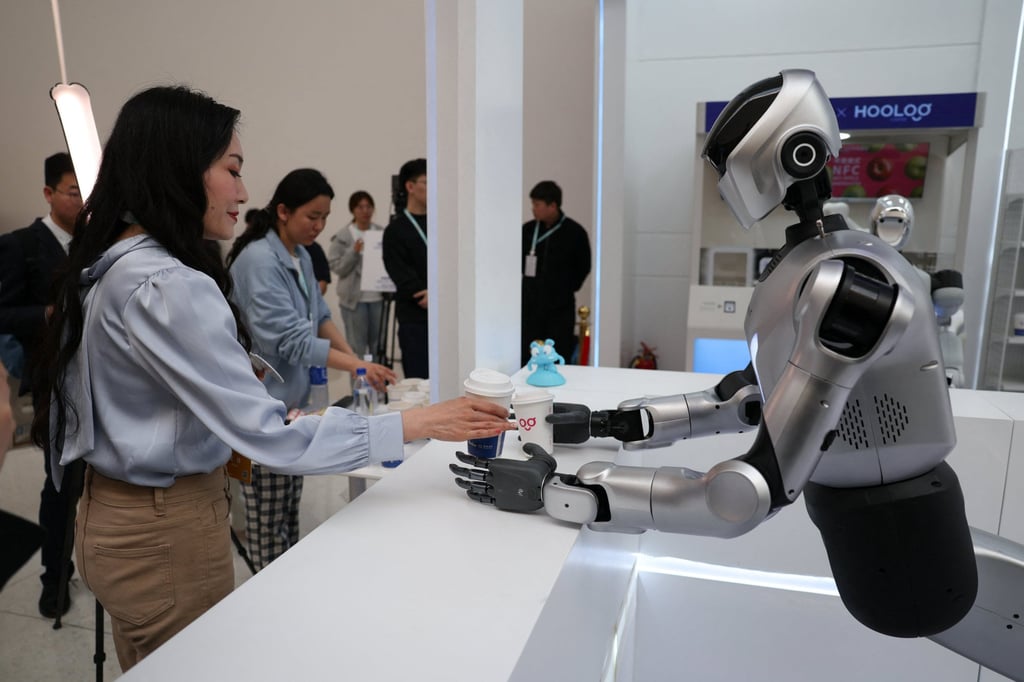A Kuavo-5W humanoid robot by Leju Robotics passes freshly made coffee to a journalist during a demonstration at the 2026 Zhongguancun Forum, a major annual technology conference in Beijing on March 25. Photo: Reuters A Kuavo-5W humanoid robot by Leju Robotics passes freshly made coffee to a journalist during a demonstration at the 2026 Zhongguancun Forum, a major annual technology conference in Beijing on March 25. Photo: Reuters