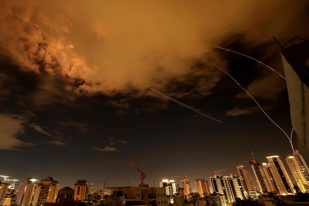 Rocket trails above the Israeli coastal city of Netanya amid a fresh barrage of Iranian missile attacks. Photo: AFP
