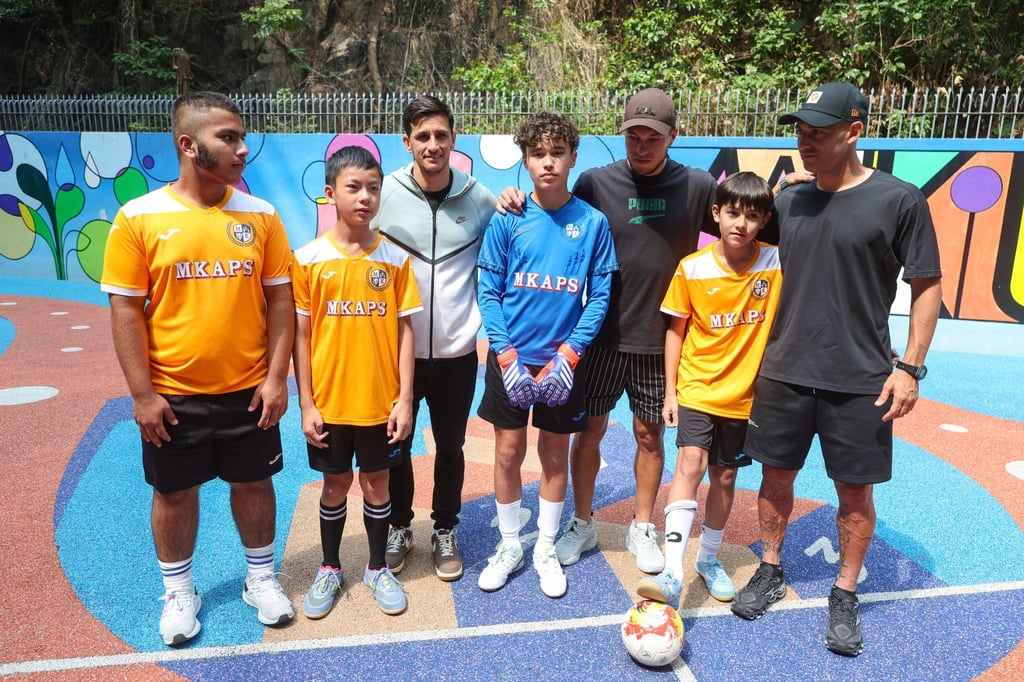 From left, Zakaria Muhammad, Karson Pang, Ruslan Mingazov, Bernardo Santos Camargo, Everton Camargo, Bautista Leonel Acosta and Jonatan Acosta at Man Kiu Association Primary School. Photo: Edmond So