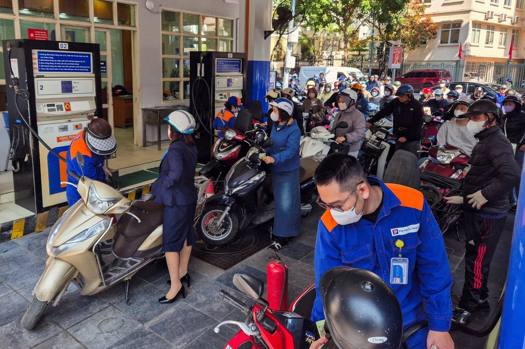 People queue to buy petrol at a station in Hanoi amid disruptions in supply and price surges due to the Iran war. Photo: Reuters People queue to buy petrol at a station in Hanoi amid disruptions in supply and price surges due to the Iran war. Photo: Reuters