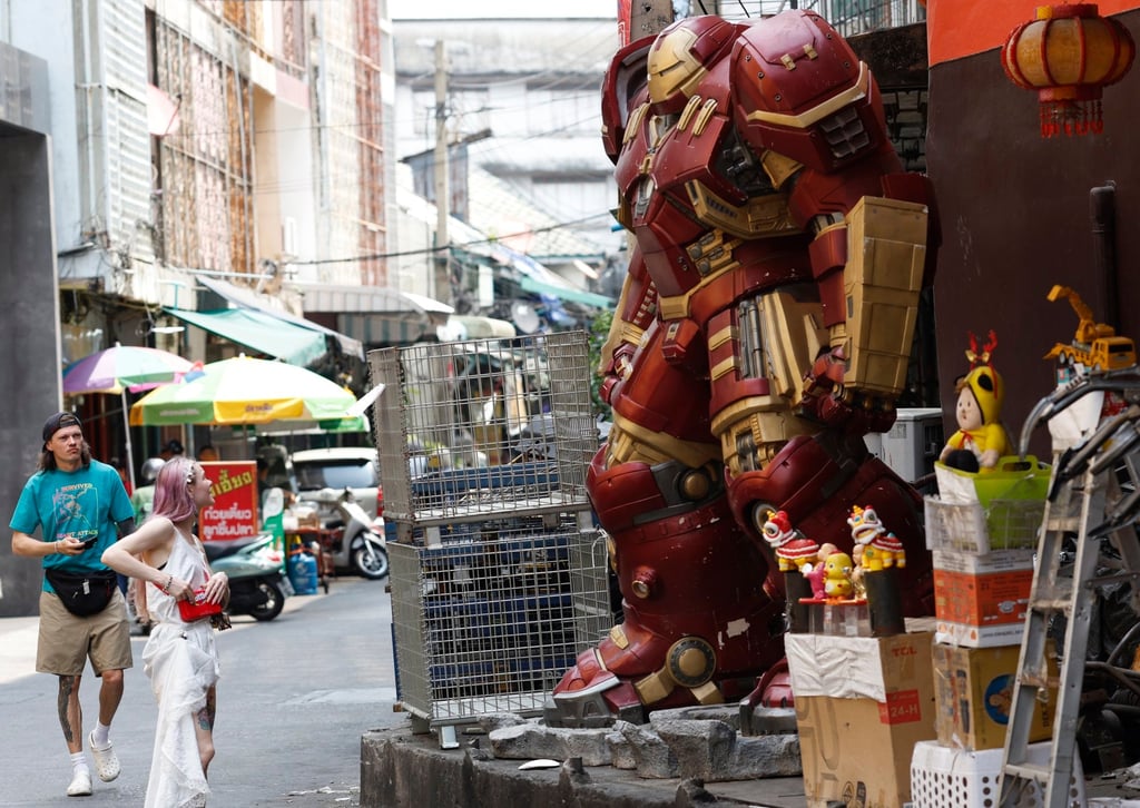 Foreign tourists look at a robot figure made from metal scrap at a tourist spot in Talad Noi, a historic community in Bangkok, Thailand. Photo: EPA Foreign tourists look at a robot figure made from metal scrap at a tourist spot in Talad Noi, a historic community in Bangkok, Thailand. Photo: EPA