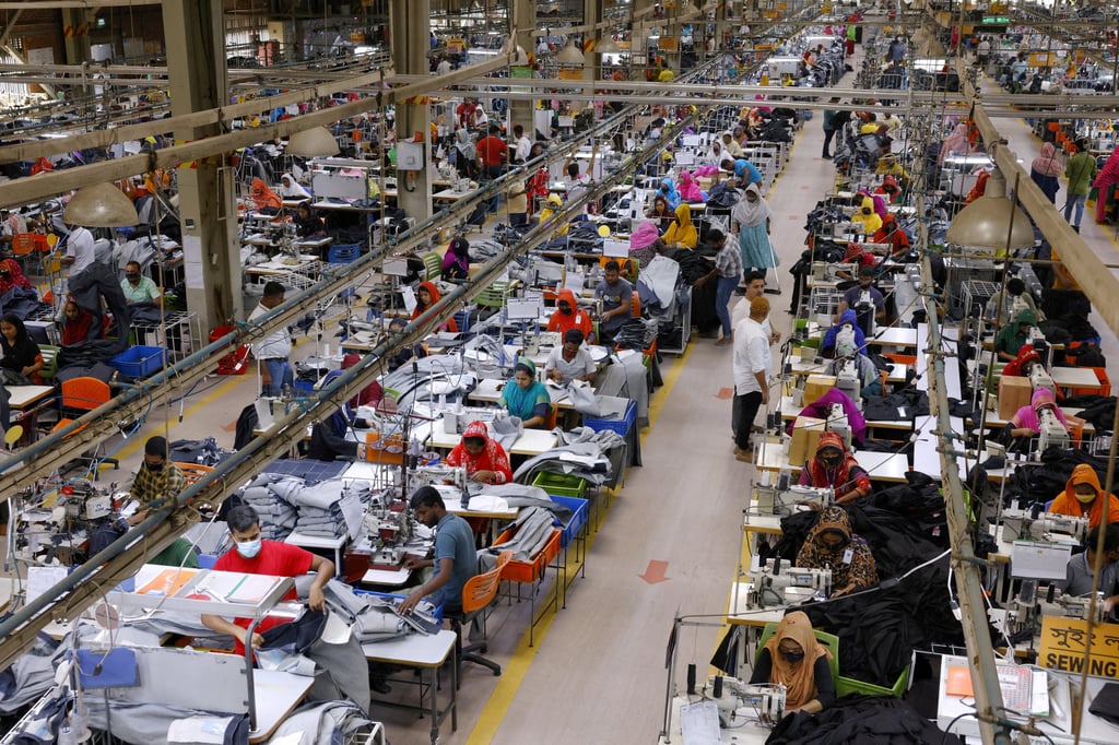 Workers make clothing in the sewing section of a garment factory in Gazipur, Bangladesh. Photo: Reuters Workers make clothing in the sewing section of a garment factory in Gazipur, Bangladesh. Photo: Reuters