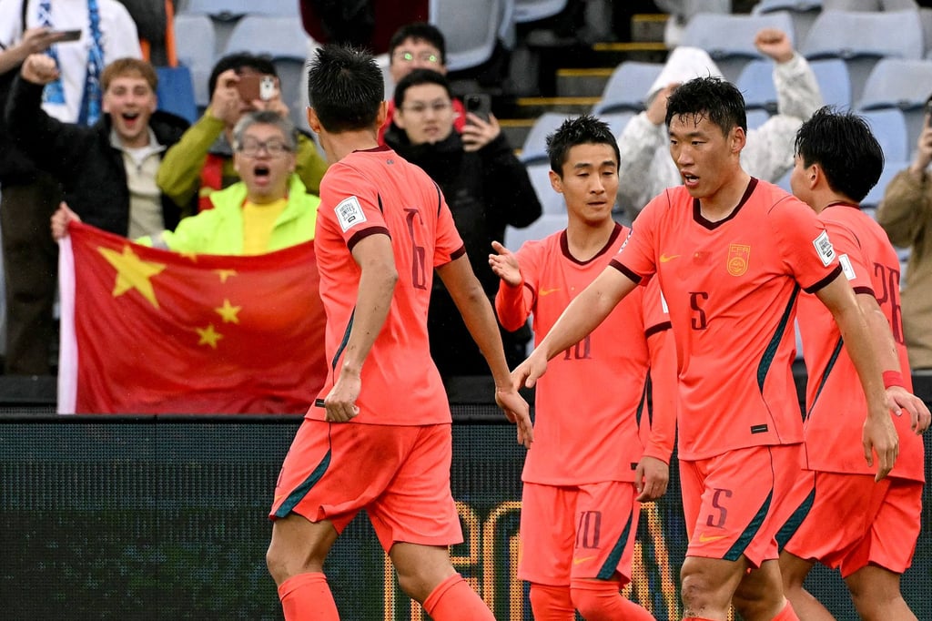 Wei Shihao (centre) celebrates with teammates after scoring China’s first goal. Photo: AFP Wei Shihao (centre) celebrates with teammates after scoring China’s first goal. Photo: AFP