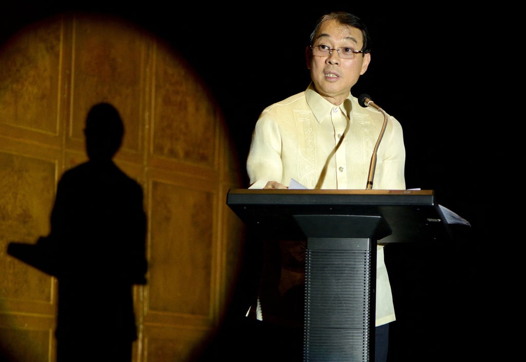 Jollibee founder Tony Tan Caktiong speaks to shareholders in Manila in 2013. Photo: AFP
