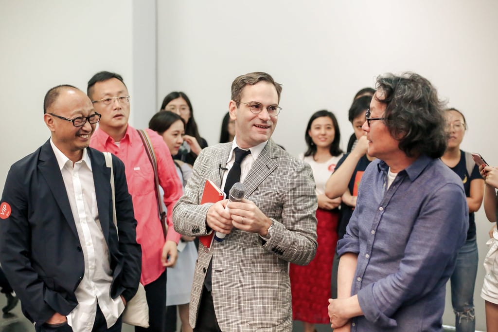 Philip Tinari (centre) and mainland artist Xu Bing (right). Photo: Handout Philip Tinari (centre) and mainland artist Xu Bing (right). Photo: Handout