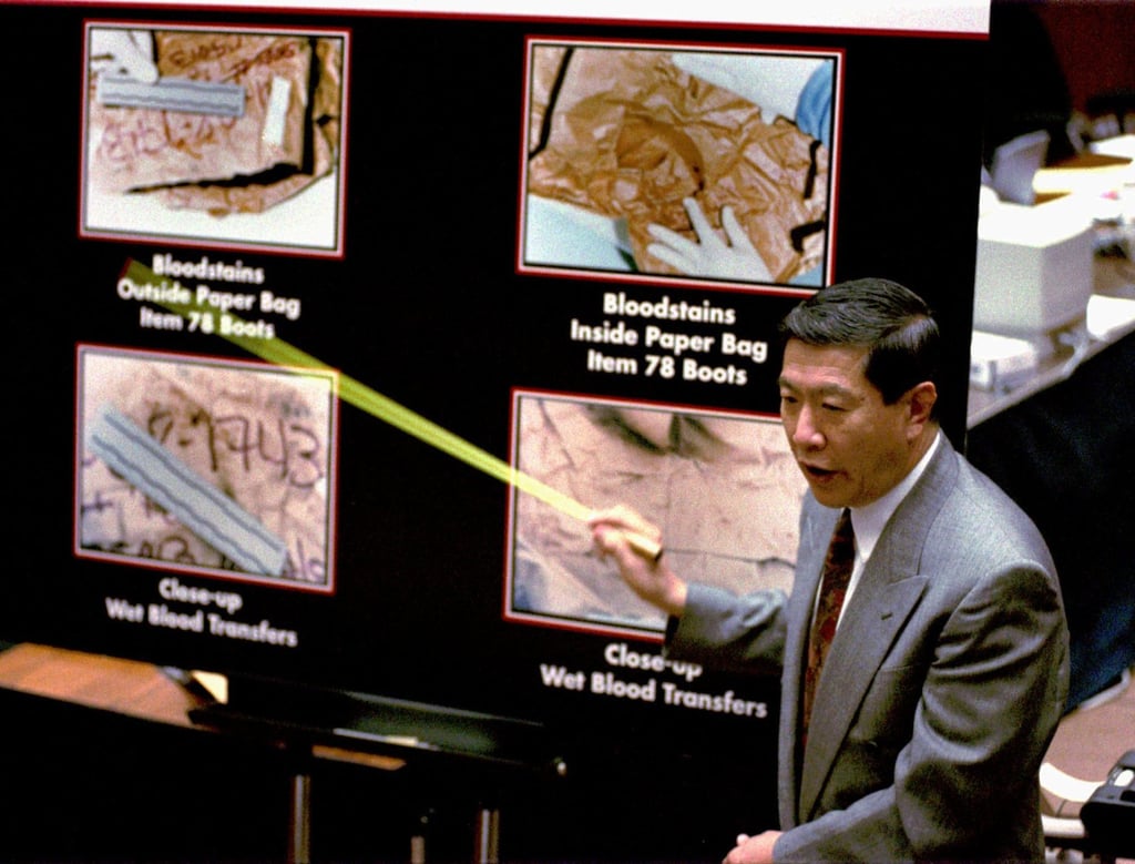 Forensic scientist Henry Lee uses a pointer as he describes how blood stains were transferred from evidence items to the paper bags they were carried in during the O.J. Simpson trial in Los Angeles in August 1995. Photo: AP Forensic scientist Henry Lee uses a pointer as he describes how blood stains were transferred from evidence items to the paper bags they were carried in during the O.J. Simpson trial in Los Angeles in August 1995. Photo: AP