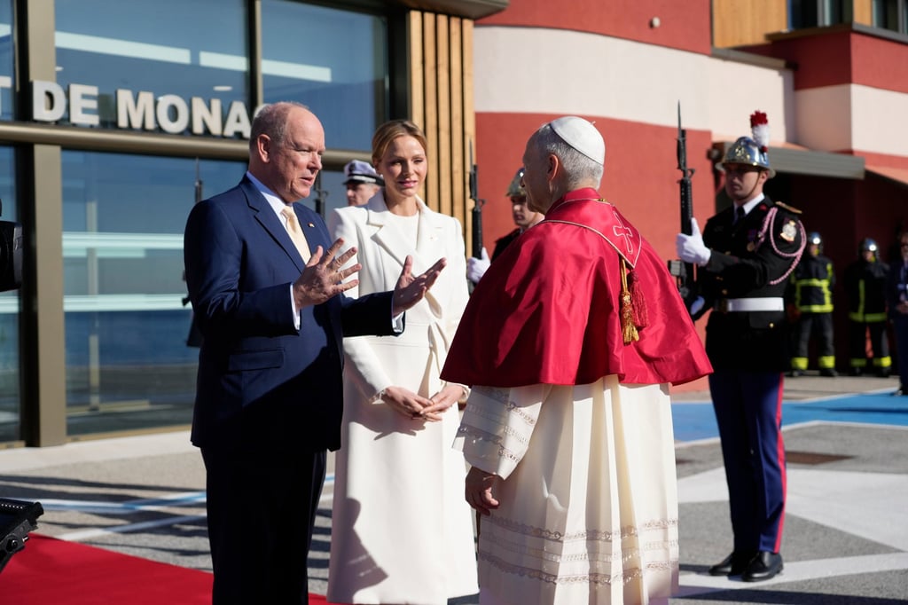 Prince Albert II of Monaco and Princess Charlene of Monaco welcome Pope Leo on the tarmac of Monaco Heliport in Monte Carlo. Photo: AP