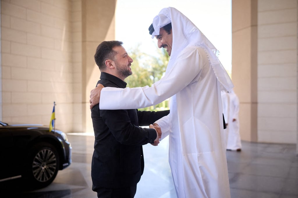Ukraine’s President Volodymyr Zelensky (left) and Qatar’s Emir Sheikh Tamim bin Hamad Al-Thani shake hands during their meeting in Doha on Saturday. Photo: Ukrainian Presidential Press Service/AFP