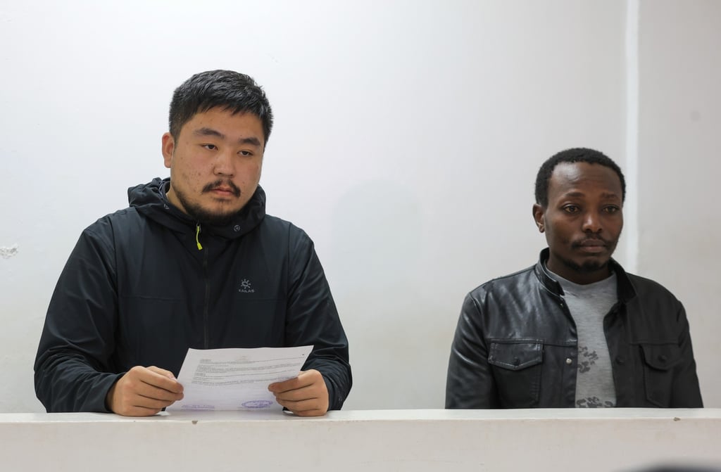Zhang Kequn, a Chinese national, and Charles Mwangi, a Kenyan citizen, appear in court on March 17 accused of trying to smuggle live queen harvester ants out of the country. Photo: AP Zhang Kequn, a Chinese national, and Charles Mwangi, a Kenyan citizen, appear in court on March 17 accused of trying to smuggle live queen harvester ants out of the country. Photo: AP