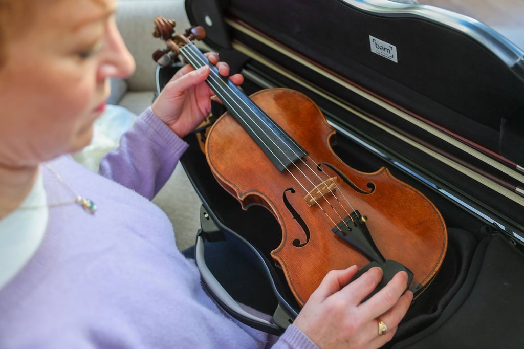 Carolin Widmann with her 244-year-old violin in her flat. Photo: Jan Woitas/dpa