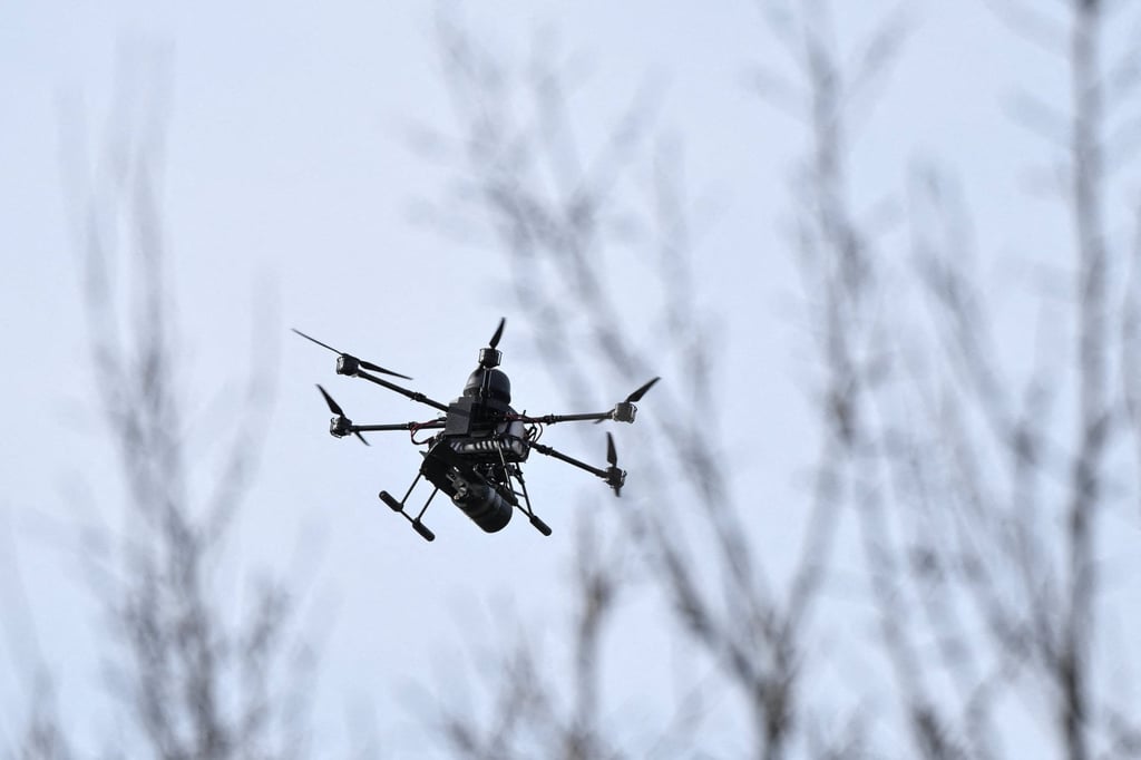 An armed Ukrainian drone flies over a training ground in the Zaporizhzhia region with a bomb attached last week. Photo: Reuters