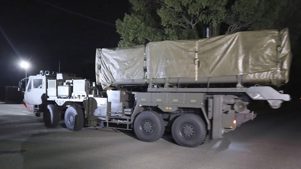 A vehicle carrying the first batch of Japan’s long-range missiles arrives at Camp Kengun in Kumamoto on March 9. Photo: Kyodo News via AP