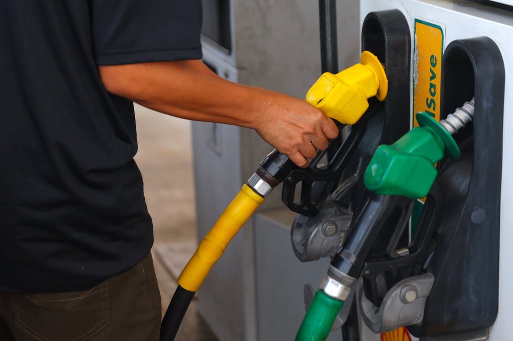 A man fills up his car with fuel at a petrol station in Port Dickson, Negri Sembilan, Malaysia, on Wednesday. Photo: EPA
