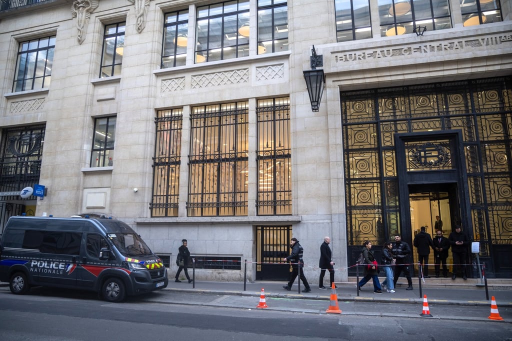 A French police van is parked outside the Bank of America headquarters in Paris on Wednesday. Photo: EPA