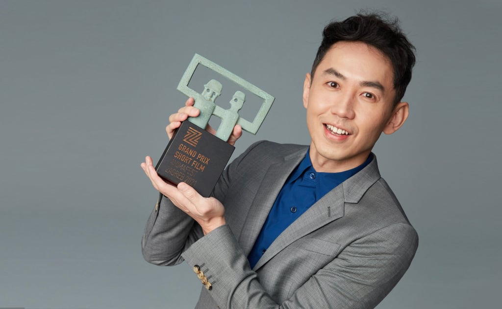 Taiwanese director Joe Hsieh holds his grand prix short film award for Night Bus (2019), given at Animafest Zagreb in 2021.