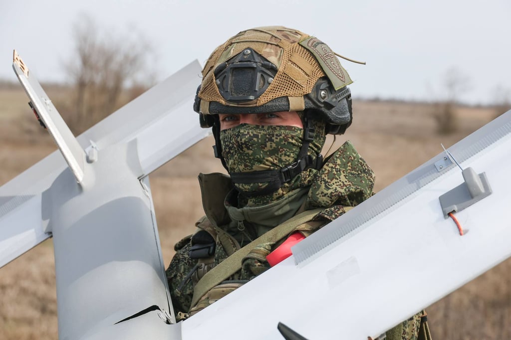 A Russian serviceman holding a drone. Photo: Tass via ZUMA Press/dpa