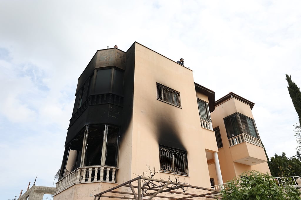 Palestinians inspect the damage in the West Bank village of Deir al-Hatab, east of Nablus, following an attack by Israeli settlers. Photo: EPA