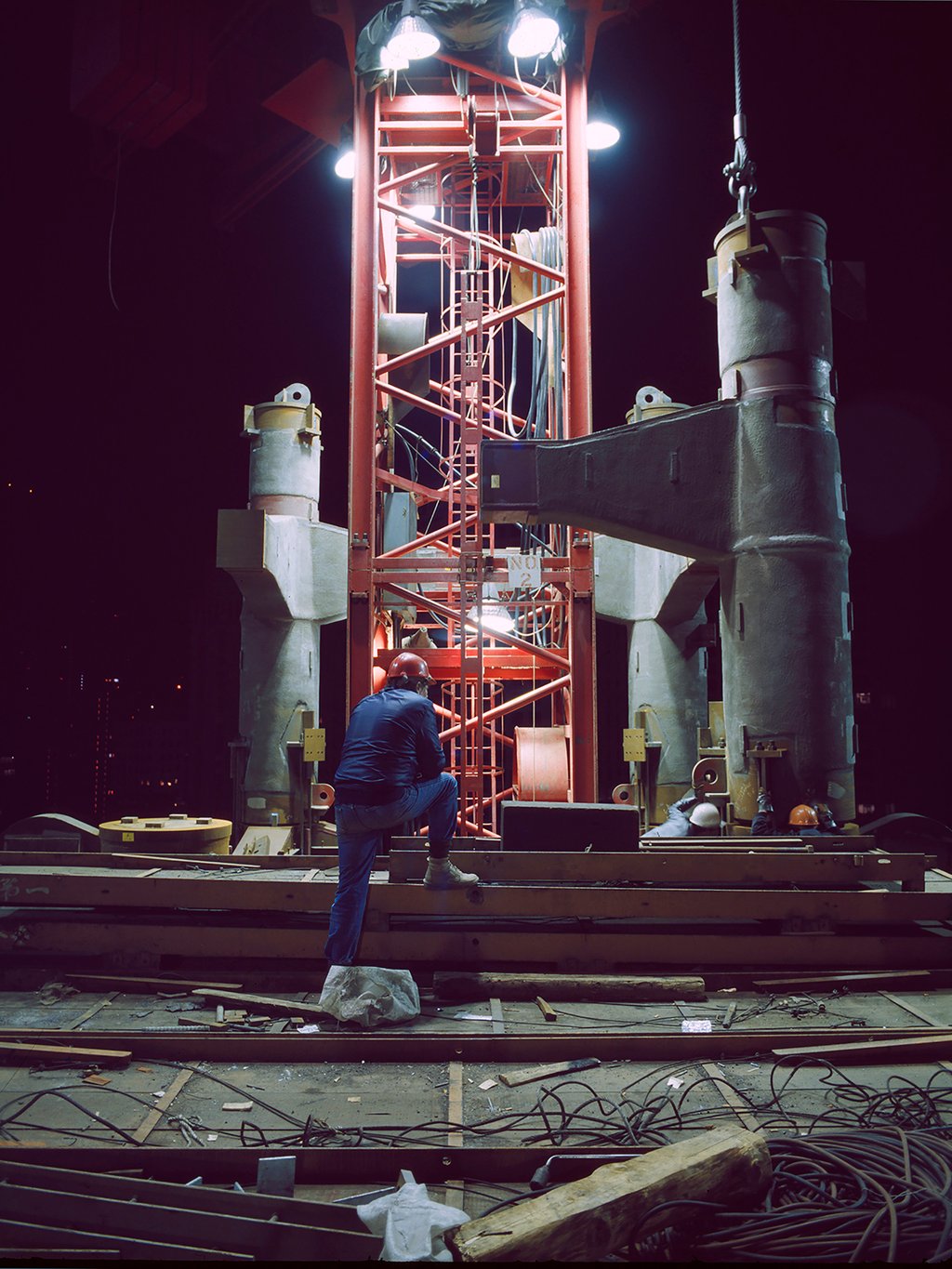 The Central location and limited access meant large loads were delivered late at night. Almost all major steelwork was lifted in the early hours, the mast sections being fitted here forming part of the truss at levels 28-29. Photo: Ian Lambot The Central location and limited access meant large loads were delivered late at night. Almost all major steelwork was lifted in the early hours, the mast sections being fitted here forming part of the truss at levels 28-29. Photo: Ian Lambot