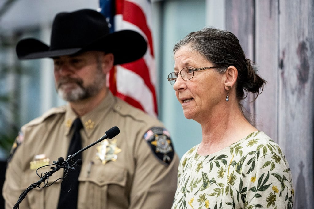 Michelle Impala, sister of Laura Ann Aime, speaks next to Utah County Sheriff Mike Smith during a news conference in Spanish Fork on Wednesday. Photo: The Deseret News via AP