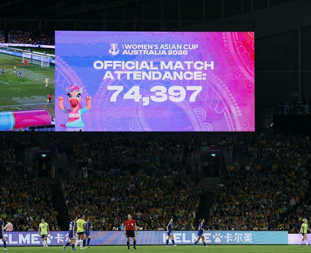 A screen displays a match attendance for the final at Stadium Australia in Sydney. Photo: Kyodo A screen displays a match attendance for the final at Stadium Australia in Sydney. Photo: Kyodo