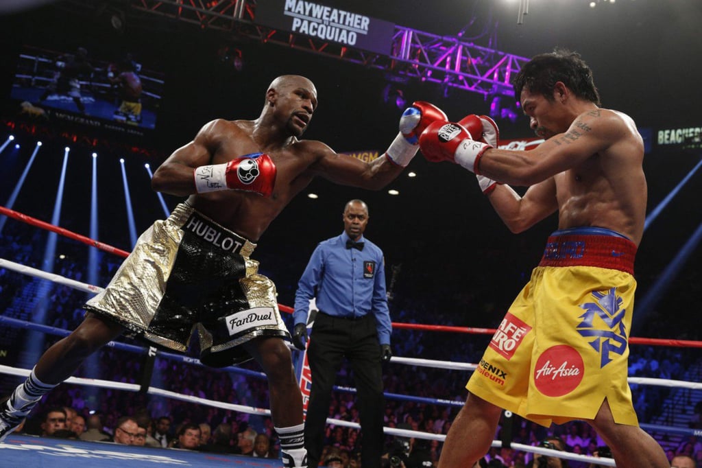 Floyd Mayweather (left) beat Manny Pacquiao in a welterweight unification bout in 2015. Photo: AFP