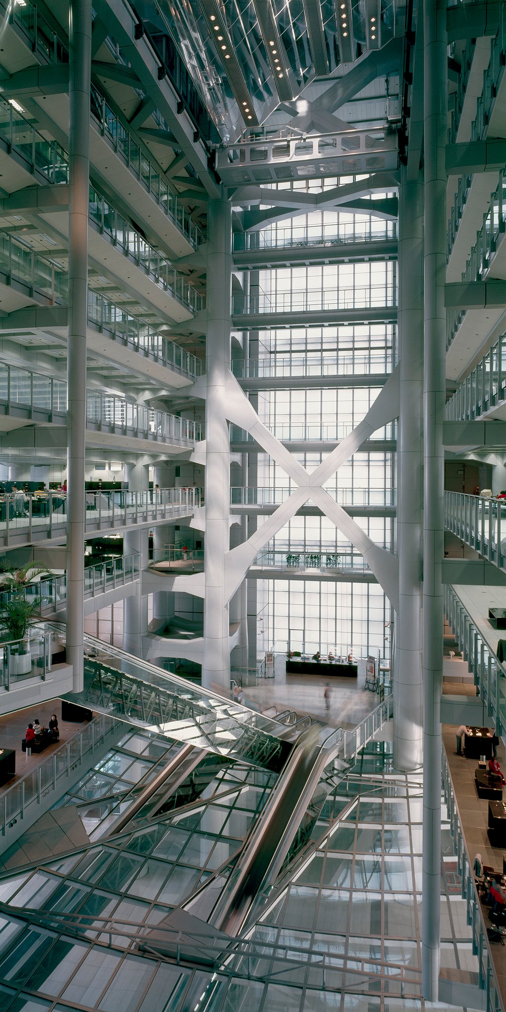 The resplendent, 55-metre-high banking hall atrium, capped by the internal sunscoop, with its alternating rows of mirrors and spotlights. This device was designed to reflect natural light into the atrium and plaza below from the 33-metre-long, mirrored external sunscoop erected on the south side of the building at level 12. Photo: Ian Lambot The resplendent, 55-metre-high banking hall atrium, capped by the internal sunscoop, with its alternating rows of mirrors and spotlights. This device was designed to reflect natural light into the atrium and plaza below from the 33-metre-long, mirrored external sunscoop erected on the south side of the building at level 12. Photo: Ian Lambot