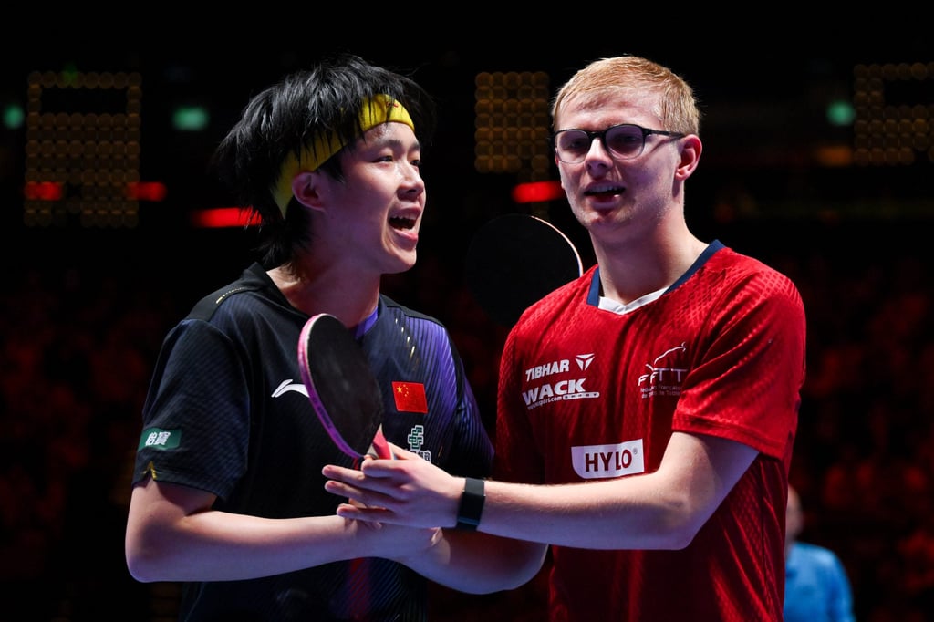 Wang Chuqin (left) needed all his skills to get past Felix Lebrun. Photo: Xinhua