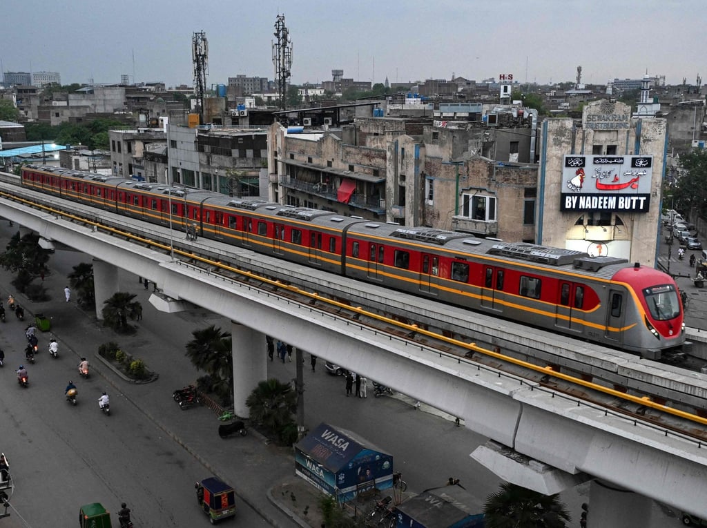 A metro train glides along an elevated track in Lahore, Punjab, on Friday. Photo: AFP
