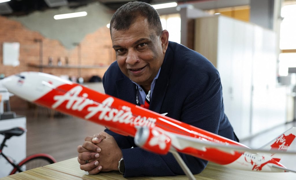 Tony Fernandes, the CEO of AirAsia’s parent company, Capital A, poses with a model of his company’s plane. Photo: Reuters Tony Fernandes, the CEO of AirAsia’s parent company, Capital A, poses with a model of his company’s plane. Photo: Reuters