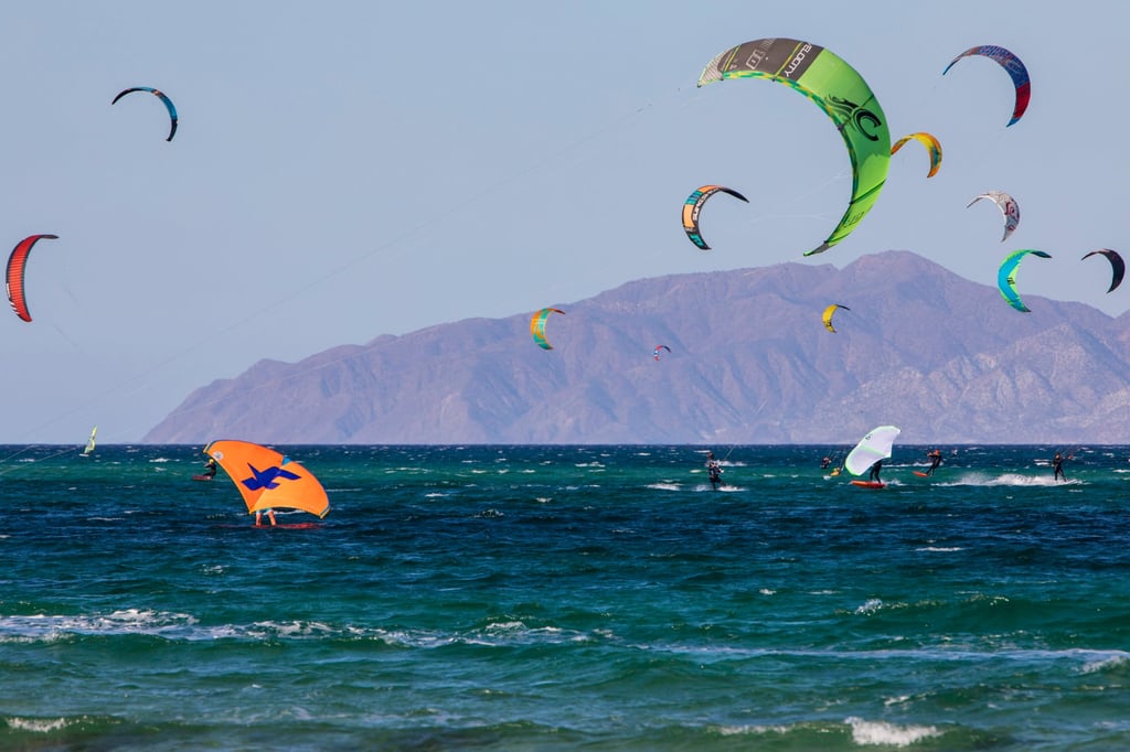 People kitesurf and kitewing in the waters of La Ventana in Mexico. Photo: Getty Images