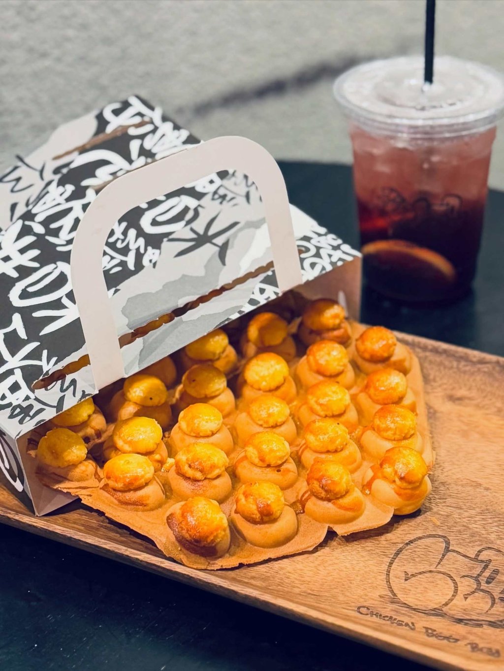 Egg waffles topped with pineapple bun crust from Chicken Egg Boy. Photo: Instagram/hungrila_foodie