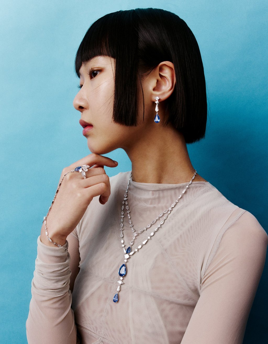 Necklace, earring, bracelet, ring: Cartier. Top, bodysuit: Rick Owens